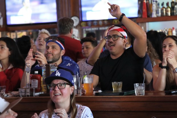 Fans react during an Olympics viewing party at Legends Sports...