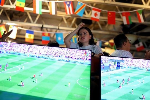 A fan watches from the upper level during an Olympics...