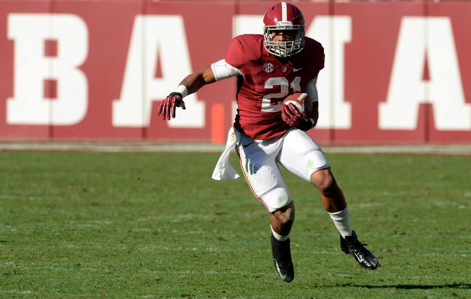 November 17, 2012; Tuscaloosa, AL, USA; Alabama Crimson Tide running back Brent Calloway (21) carries against the Western Carolina Catamounts during the fourth quarter at Bryant Denny Stadium. Alabama defeated the Western Carolina 49-0. Mandatory Credit: John David Mercer-USA TODAY Sports