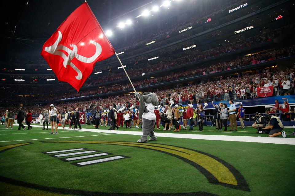 Dec 31, 2021; Arlington, Texas, USA; The Alabama Crimson Tide mascot Big Al waves the flag after the game against the Cincinnati Bearcats at the 2021 Cotton Bowl college football CFP national semifinal game at AT&T Stadium. Mandatory Credit: Tim Heitman-USA TODAY Sports