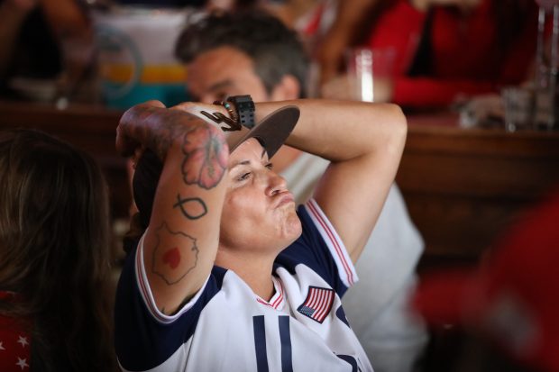 Fans react during an Olympics viewing party at Legends Sports...