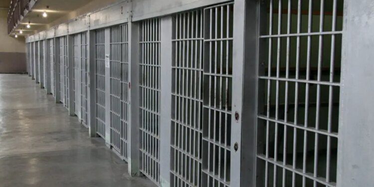 Row of prison cells in a cell block