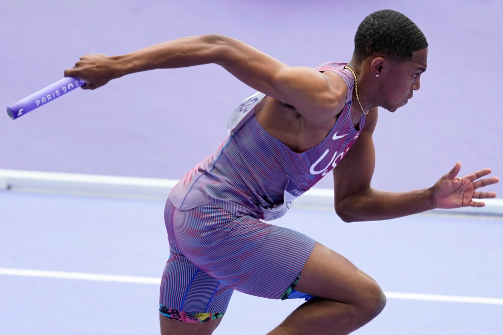 Quincy Wilson starts in a men's 4 x 400 meters relay round 1 heat at the 2024 Summer Olympics.