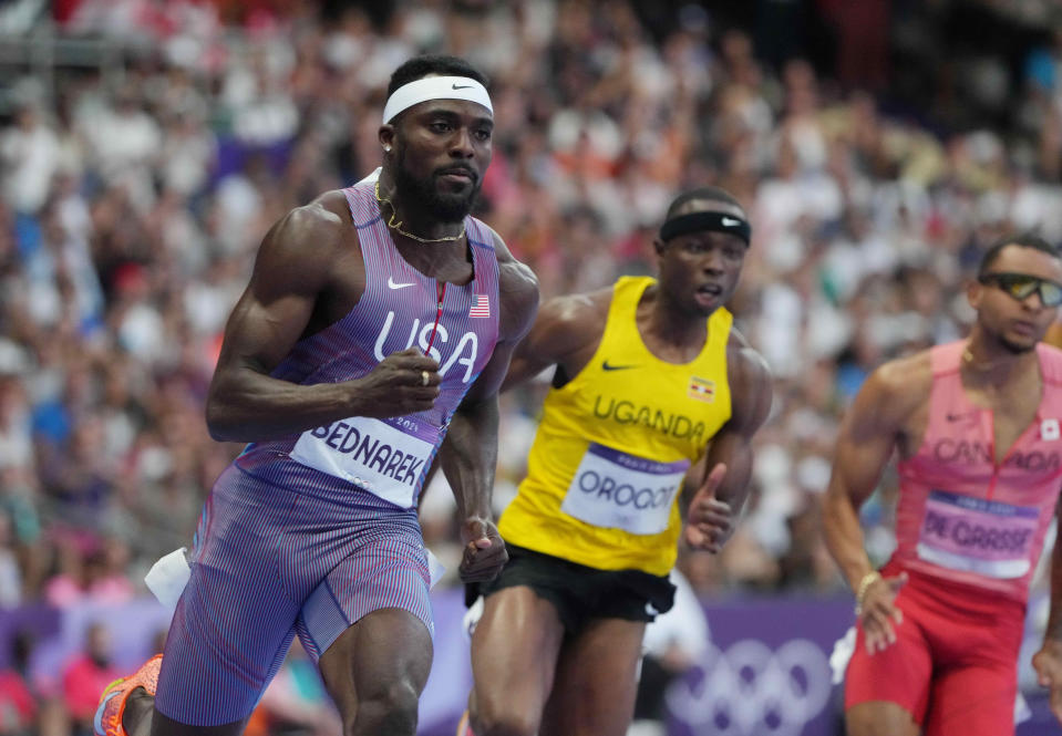 Kenny Bednarek races in the men's 200-meter semifinals during the Paris 2024 Olympic Summer Games at Stade de France on Wednesday, Aug. 7, 2024.