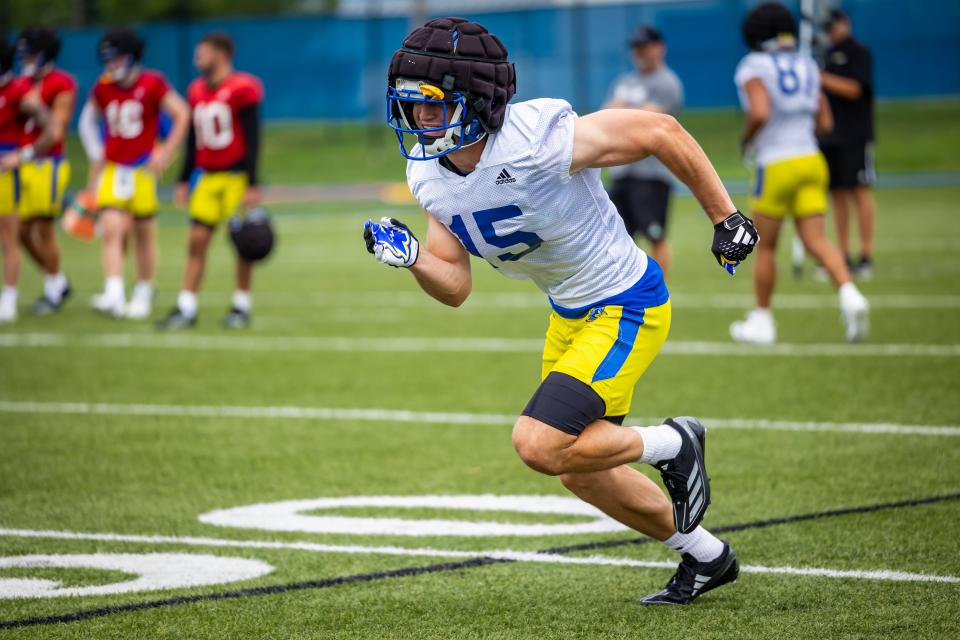 Michigan transfer Jake Thaw begins a pass route at Delaware practice.