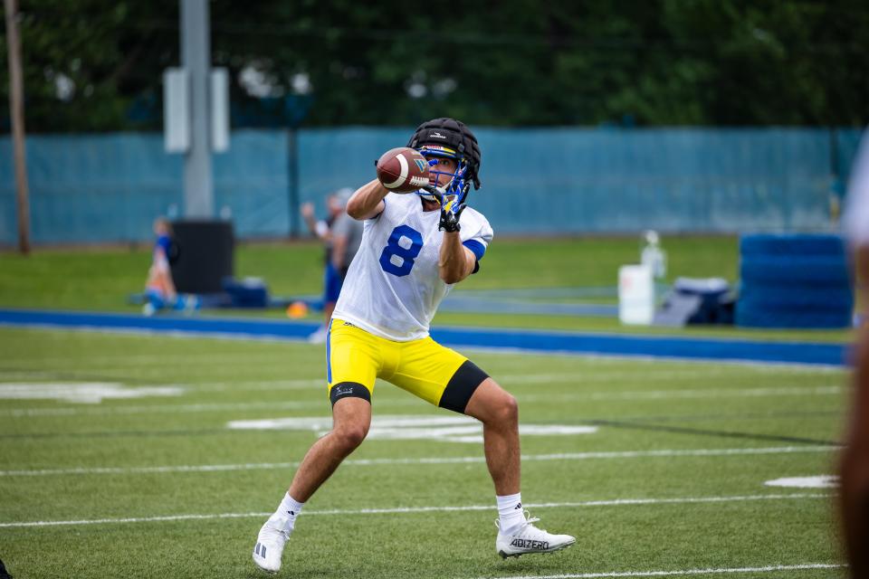 Cornell transfer Nicholas Laboy makes a reception at Delaware football practice.