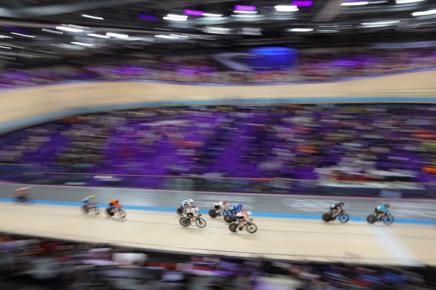 Riders compete in the women's track cycling omnium points race of the Paris 2024 Olympic Games at the Saint-Quentin-en-Yvelines National Velodrome in Montigny-le-Bretonneux, south-west of Paris, on August 11, 2024. (Photo by Thomas SAMSON / AFP) (Photo by THOMAS SAMSON/AFP via Getty Images)