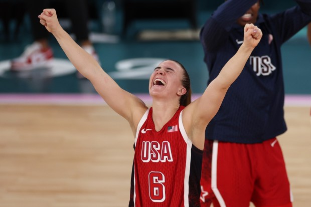 Sabrina Ionescu #6 of Team United States celebrates after her team's victory against Team France during the Women's Gold Medal game between Team France and Team United States on day sixteen of the Olympic Games Paris 2024 at Bercy Arena on August 11, 2024 in Paris, France. (Photo by Sarah Stier/Getty Images)