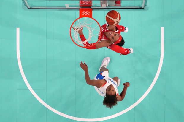 An overview shows USA's #09 A'ja Wilson shooting in the women's Gold Medal basketball match between France and the USA during the Paris 2024 Olympic Games at the Bercy Arena in Paris on August 11, 2024. (Photo by Bryan SNYDER / POOL / AFP) (Photo by BRYAN SNYDER/POOL/AFP via Getty Images)