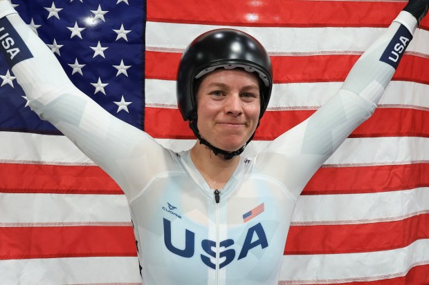 US' Jennifer Valente celebrates her victory after winning the women's track cycling omnium event of the Paris 2024 Olympic Games at the Saint-Quentin-en-Yvelines National Velodrome in Montigny-le-Bretonneux, south-west of Paris, on August 11, 2024. (Photo by Emmanuel DUNAND / AFP) (Photo by EMMANUEL DUNAND/AFP via Getty Images)