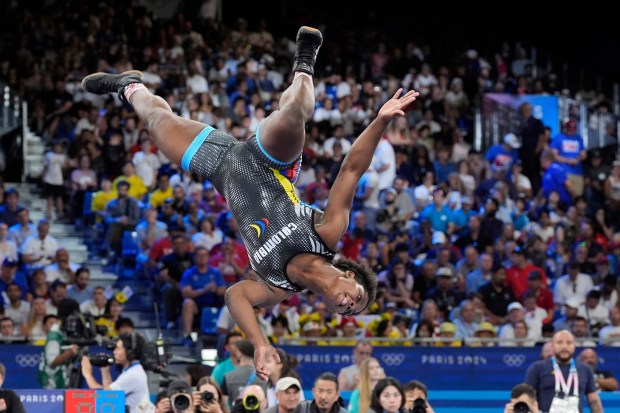 Colombia's Tatiana Renteria Renteria celebrates after defeating Ecuador's Genesis Rosangela Reasco Valdez in their women's freestyle 76kg bronze medal wrestling match, at Champ-de-Mars Arena, during the 2024 Summer Olympics, Sunday, Aug. 11, 2024, in Paris, France. (AP Photo/Eugene Hoshiko)