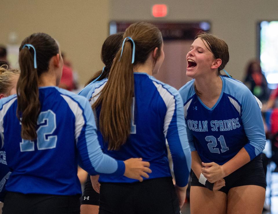 Ocean Springs' Anna Hoffmayer (21) celebrates a play with her teammates during MHSAA's Mississippi Volleyball Invitational at the Jackson Convention Complex in Jackson, Miss., on Friday, Aug. 2, 2024.