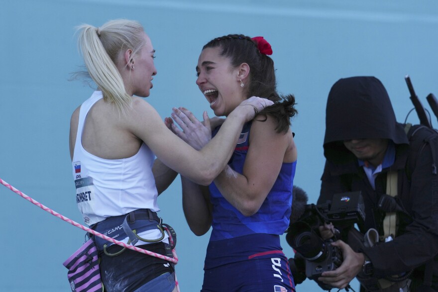 Gold medallist Janja Garnbret of Slovenia, left, congratulates silver medallist Brooke Raboutou of the United States during the women's boulder and lead final for the sport climbing competition at the 2024 Summer Olympics, Saturday, Aug. 10, 2024, in Le Bourget, France.