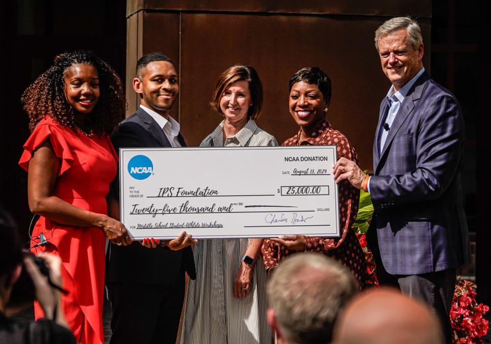 From left, Indianapolis Public Schools Superintendent, Aleesia Johnson, IPS District Director of Athletics, Darren Thomas, Chief Executive Officer at Indianapolis Public Schools Foundation, Stephannie Bailey, Felicia Martin, senior vice president of inclusion Education and Community Engagement for the NCAA, President of the NCAA, Charlie Baker speaks during a press conference celebrating the 25 year anniversary of the NCAA moving its national office to Indianapolis on Tuesday, Aug. 13, 2024, at the NCAA Headquarters in Indianapolis.