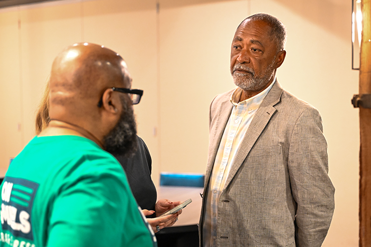 Don Samuels talking to members of his campaign while waiting for election results at his party at the Canopy by Hilton in Minneapolis on Tuesday night.