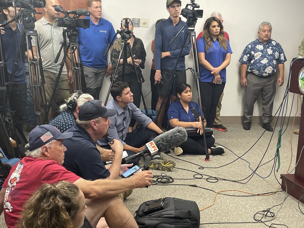 NBC news reporter Tom Llamas and iHeartMedia correspondent Steve Gregory were chided for their tough questions at a press conference on the Maui fires.