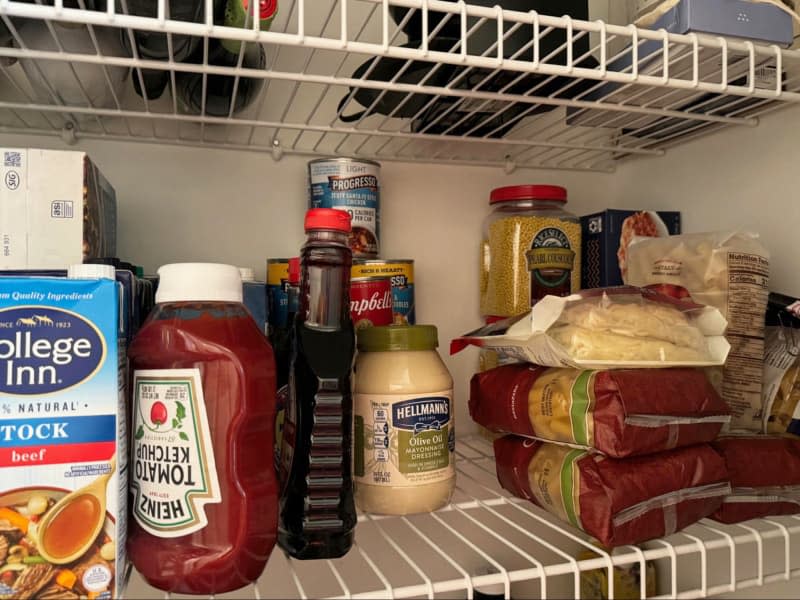 view of pantry shelves with pantry goods