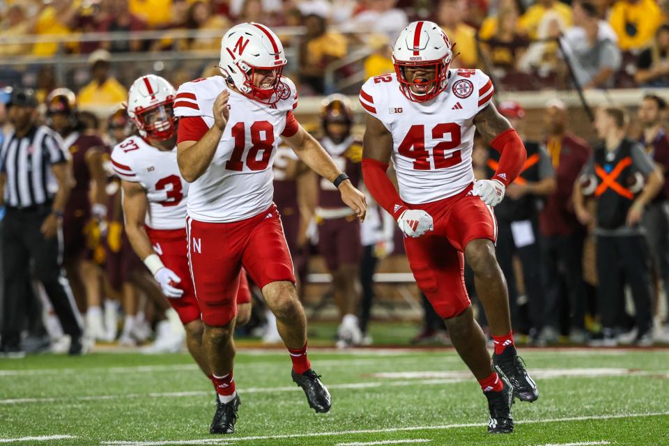 Aug 31, 2023; Minneapolis, Minnesota, USA; Nebraska Cornhuskers linebacker Eric Fields (42) celebrates a tackle against the Minnesota Golden Gophers during the third quarter at Huntington Bank Stadium. Mandatory Credit: Matt Krohn-USA TODAY Sports