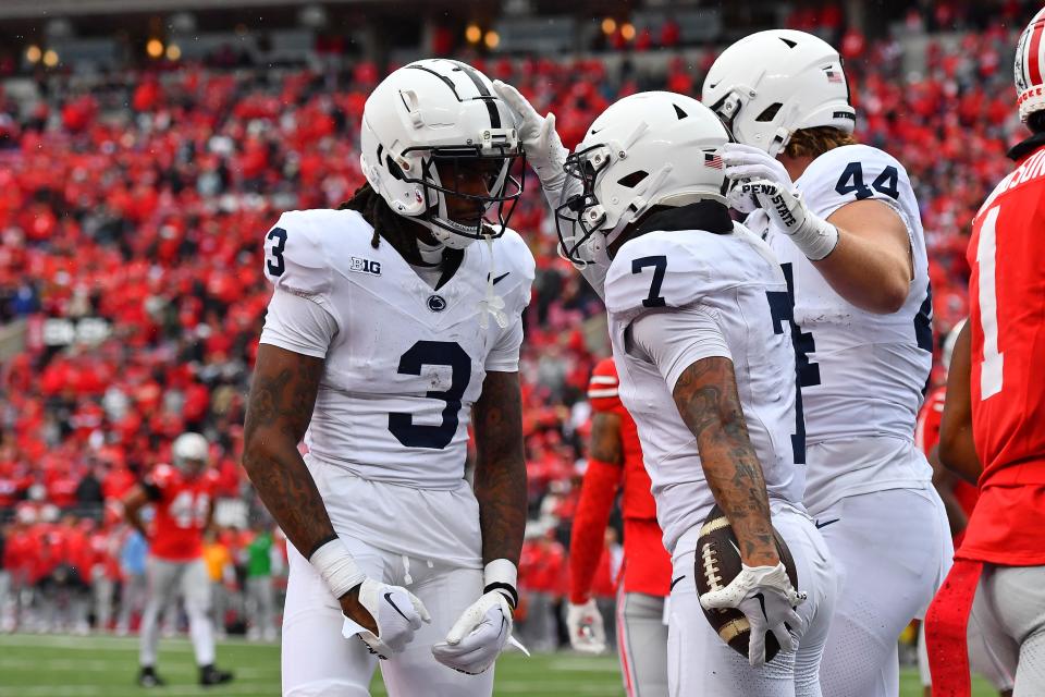 COLUMBUS, OHIO - OCTOBER 21: Kaden Saunders #7 of the Penn State Nittany Lions celebrates his fourth quarter touchdown with teammates Dante Cephas #3 and Tyler Warren #44 of the Penn State Nittany Lions during a game against the Ohio State Buckeyes at Ohio Stadium on October 21, 2023 in Columbus, Ohio. (Photo by Ben Jackson/Getty Images)