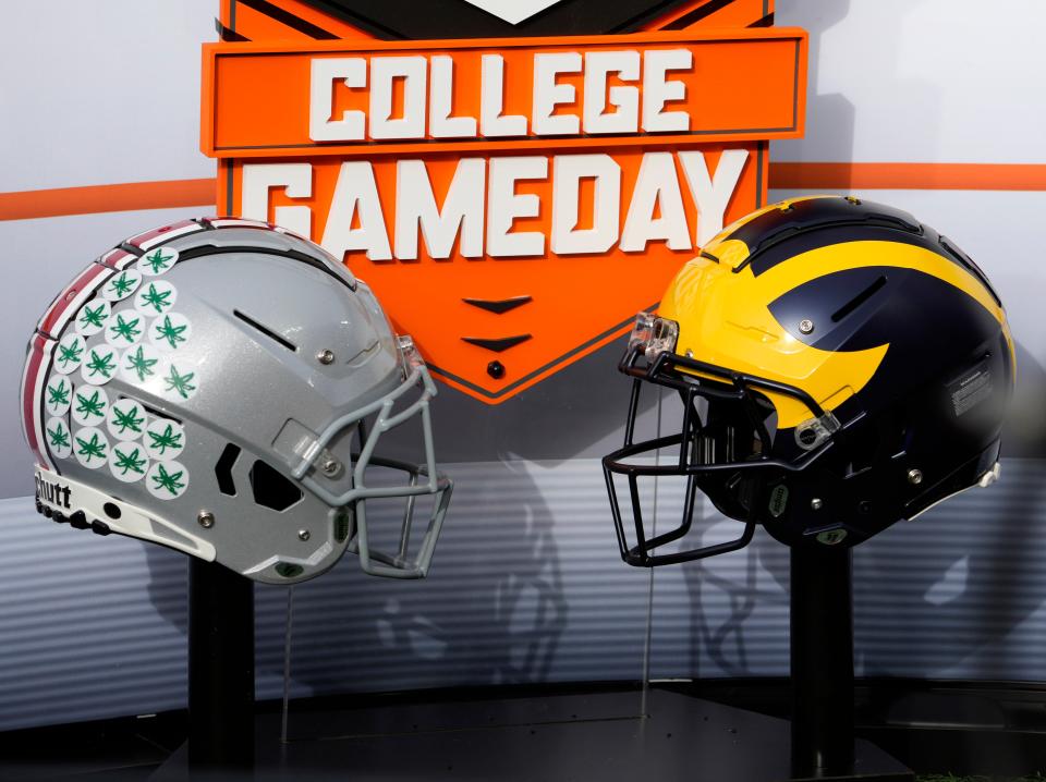 Nov. 25, 2023; Ann Arbor, Mi., USA;
Helmets for the Ohio State Buckeyes and the Michigan Wolverines decorate the on-field set for ESPNÕs College GameDay before SaturdayÕs NCAA Division I football game at Michigan Stadium.