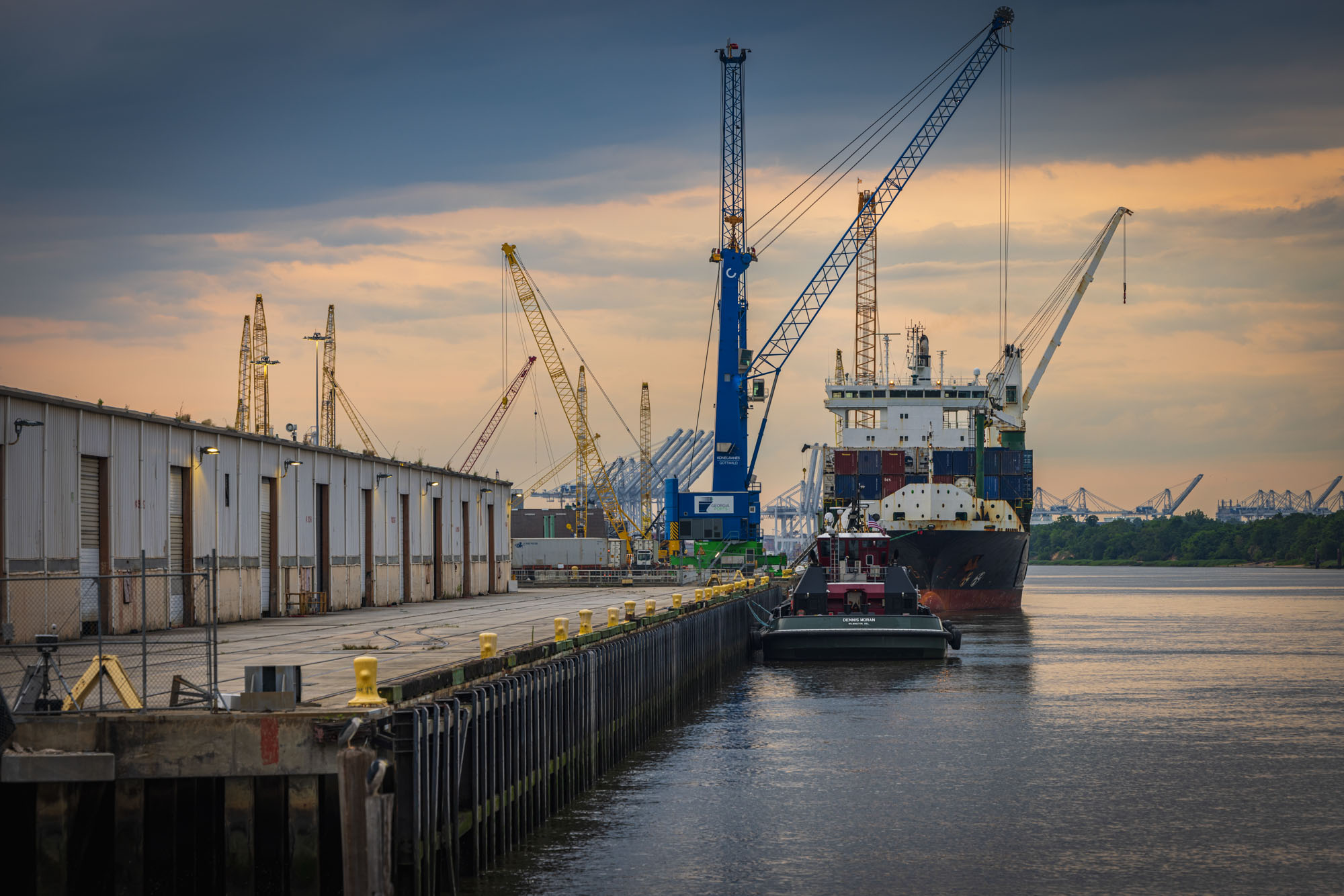 A barge is loaded at a dock.