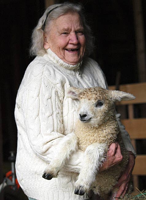 Ruth Griffin of Portsmouth holds Victoria, a two-week-old lamb, at her small farm family on Richards Avenue.