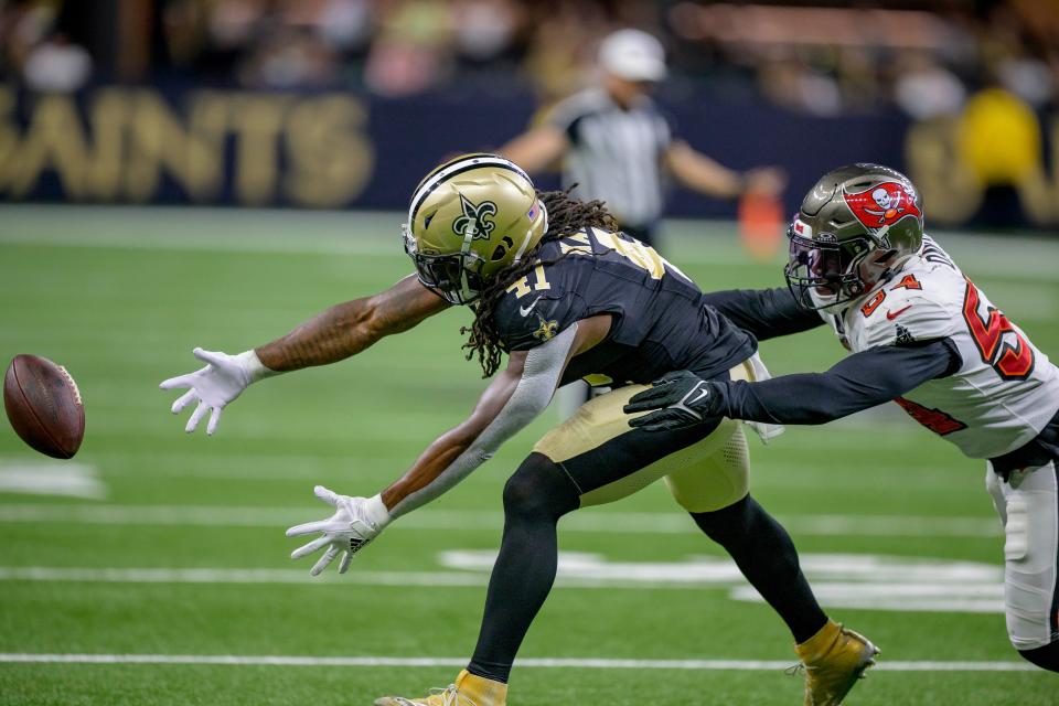 Oct 1, 2023; New Orleans, Louisiana, USA; New Orleans Saints running back Alvin Kamara (41) can’t catch a ball against Tampa Bay Buccaneers linebacker Lavonte David (54) during the fourth quarter at the Caesars Superdome. Mandatory Credit: Matthew Hinton-USA TODAY Sports ORG XMIT: IMAGN-710558 ORIG FILE ID: 20231001_tbs_ft8_344.JPG