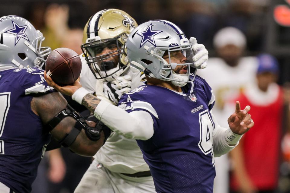 Dec 2, 2021; New Orleans, Louisiana, USA; New Orleans Saints defensive end Carl Granderson (96) and Dallas Cowboys quarterback Dak Prescott (4) during the second half at Caesars Superdome. Mandatory Credit: Stephen Lew-USA TODAY Sports