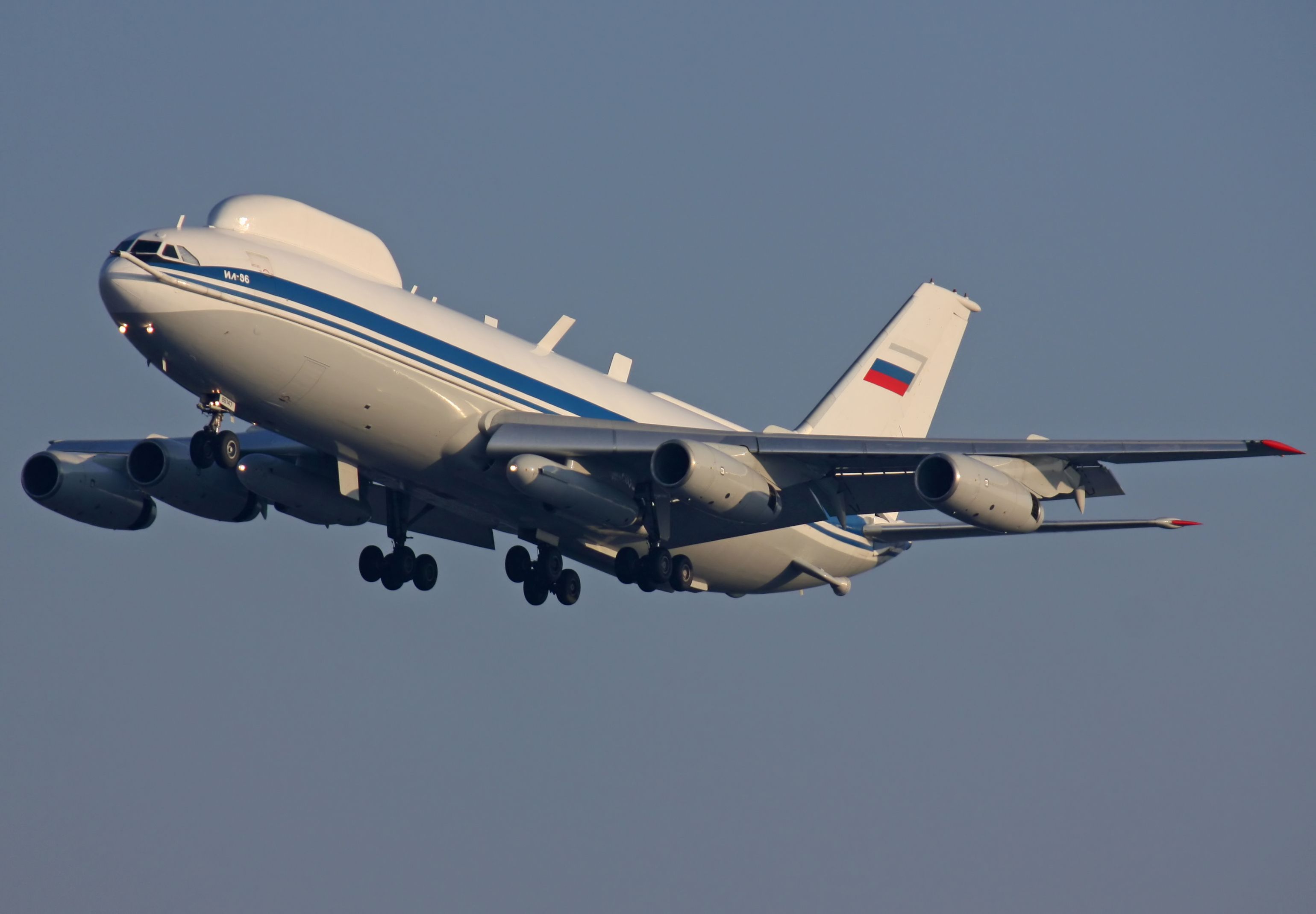 An IIlyushin Il-86 Maxdome flying in the sky.