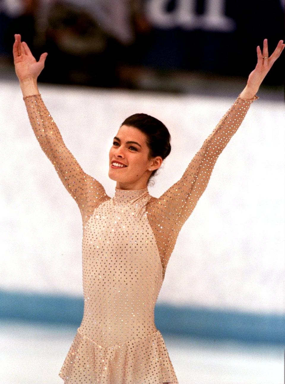 NANCY KERRIGAN ACKNOWLEDGES THE CROWD AFTER FINISHING HER LONG PERFORMANCE AT THE FIGURE SKATING COMPETITION AT THE 1994 WINTER OLYMPICS IN LILLEHAMMER. KERRIGAN FINISHED IN SECOND PLACE.