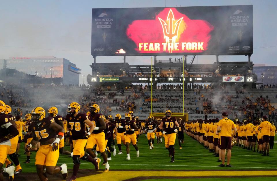 The Arizona State Sun Devils take the field during their home opener against the Southern Utah Thunderbirds at Mountain America Stadium in Tempe on Aug. 31, 2023.