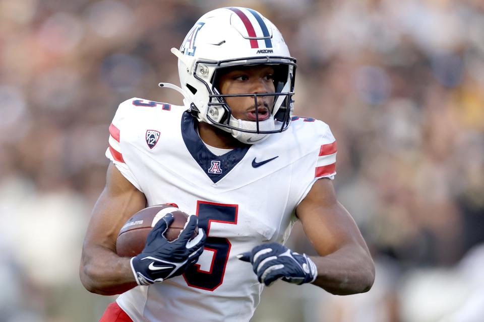 BOULDER, COLORADO - NOVEMBER 11: Montana Lemonious-Craig #5 of the Arizona Wildcats carries the ball after making a reception against the Colorado Buffaloes in the fourth quarter at Folsom Field on November 11, 2023 in Boulder, Colorado. (Photo by Matthew Stockman/Getty Images)