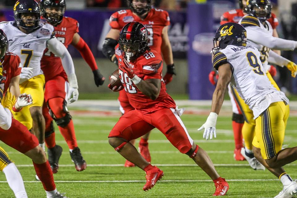 Texas Tech running back Tahj Brooks (28) weaving through California defenders during the 47th Radience Technology Independence Bowl Saturday evening, December 16, 2023, in Shreveport, La.