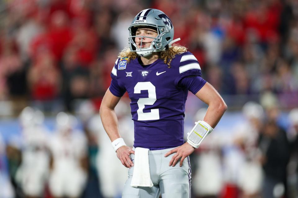 Dec 28, 2023; Orlando, FL, USA; Kansas State Wildcats quarterback Avery Johnson (2) waits for a play call against the North Carolina State Wolfpack in the first quarter during the Pop-Tarts bowl at Camping World Stadium. Mandatory Credit: Nathan Ray Seebeck-USA TODAY Sports