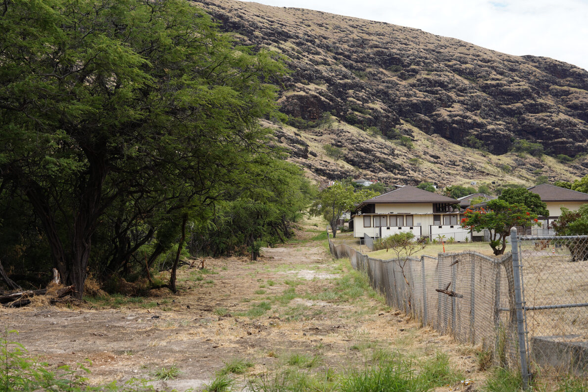 A small firebreak was cut mauka of Leihoku Elementary School Tuesday, July 30, 2024, in Waianae. These locations show areas prone to wildfire, structure fires and mitigation attempts. (Kevin Fujii/Civil Beat/2024)