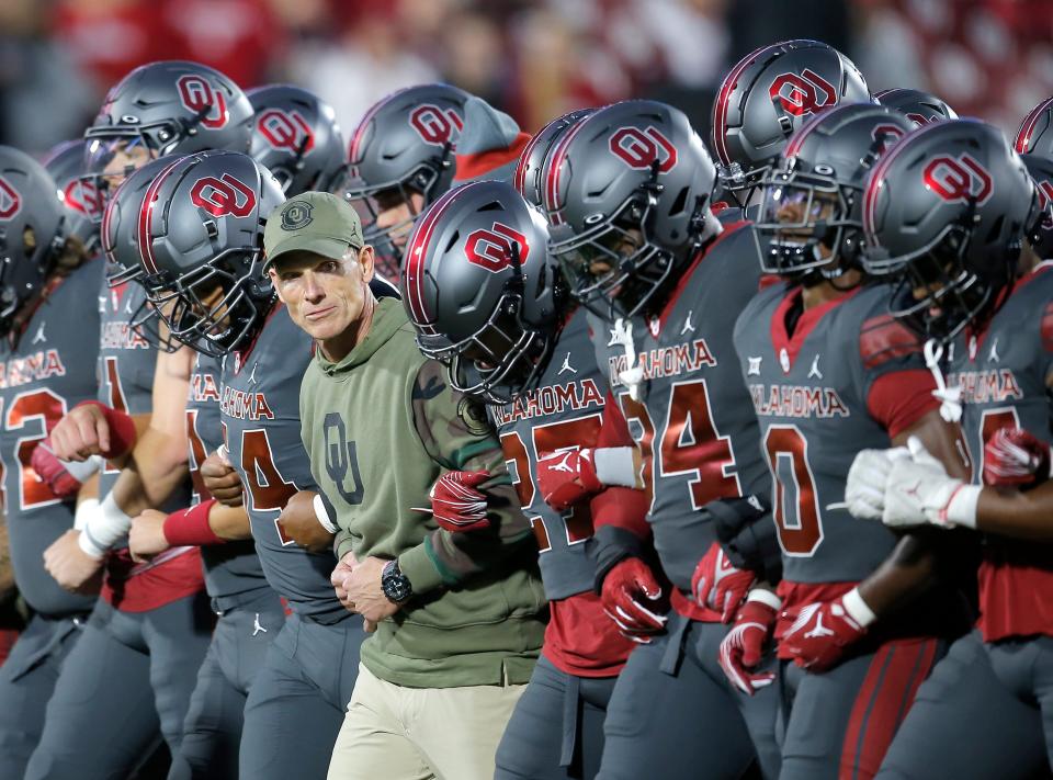 Oklahoma head coach Brent Venables lines up with players before the college football game between the University of Oklahoma Sooners and the West Virginia Mountaineers at Gaylord Family-Oklahoma Memorial Stadium in Norman, Okla., Saturday, Nov., 11, 2023. Sarah Phipps, The Oklahoman