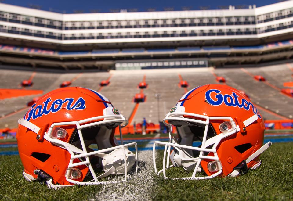 Two helmets rest on Steve Spurrier-Florida Field before the start of the Orange and Blue game at Ben Hill Griffin Stadium in Gainesville, FL on Saturday, April 13, 2024. [Doug Engle/Gainesville Sun]2024