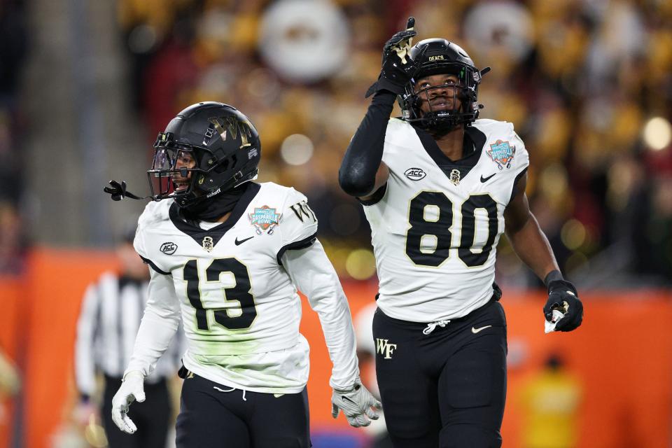 Dec 23, 2022; Tampa, Florida, USA; Wake Forest Demon Deacons wide receiver Jahmal Banks (80) scores a touchdown against the Missouri Tigers in the third quarter in the 2022 Gasparilla Bowl at Raymond James Stadium. Mandatory Credit: Nathan Ray Seebeck-USA TODAY Sports