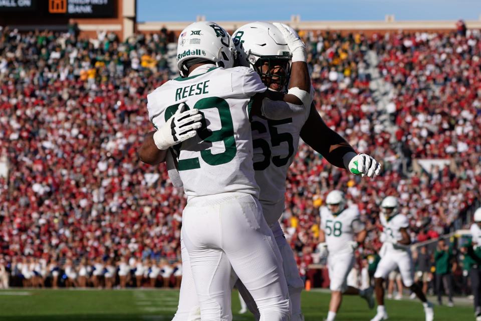 Nov 5, 2022; Norman, Oklahoma, USA; Baylor Bears running back Richard Reese (29) celebrates after scoring a touchdown with offensive lineman Micah Mazzccua (65) against the Oklahoma Sooners during the second half at Gaylord Family-Oklahoma Memorial Stadium. Mandatory Credit: Chris Jones-USA TODAY Sports