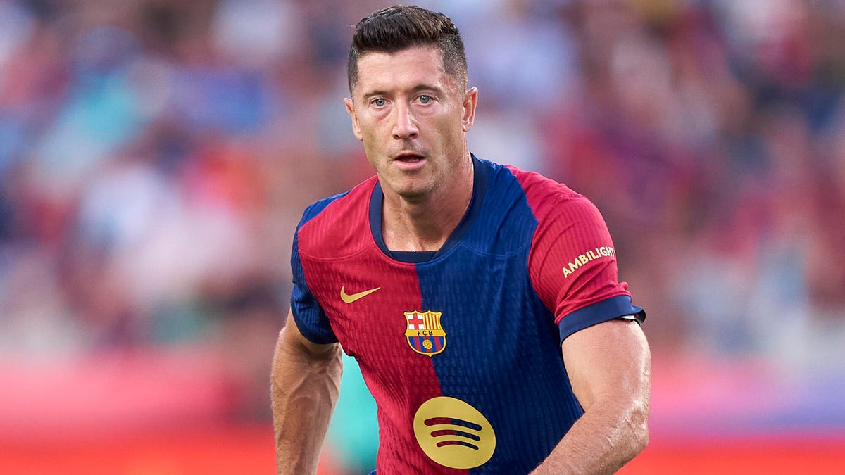 Face-on image of Barcelona striker Robert Lewandowski running towards the camera.