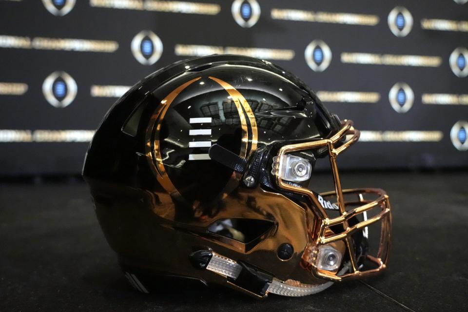 Jan 11, 2022; Indianapolis, Indiana, USA; A detailed view of College Football Playoff National Championship logo helmet at 2022 Indianapolis Host Committee press conference at the JW Marriott. Mandatory Credit: Kirby Lee-USA TODAY Sports