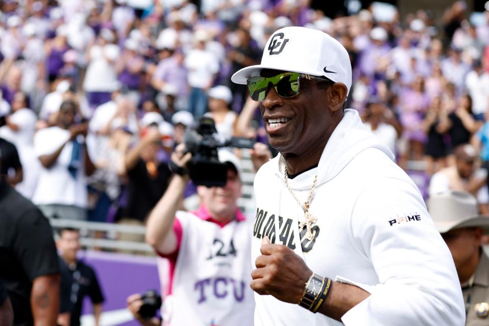 Sep 2, 2023; Fort Worth, Texas, USA; Colorado Buffaloes head coach Deon Sanders runs on the field before the game against the TCU Horned Frogs at Amon G. Carter Stadium. Mandatory Credit: Tim Heitman-USA TODAY Sports