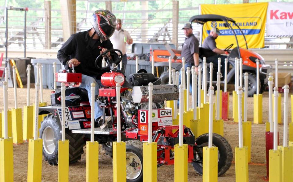 Thomas Bartholomew drives the Intimidator in the maneuverability course during the 2024 ASABE International 1/4 Scale Tractor Student Design Competition in Peoria, Ill. Pack Pullers, an engineering group at N.C. State who built the Intimidator, were named overall champions in the competition.