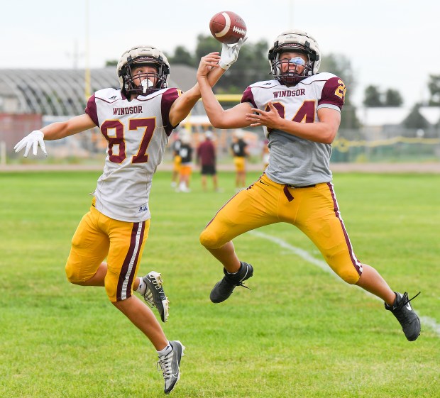 The Windsor High School football team goes through interceptions drills during practice on Wednesday Aug. 21, 2024. The team raised money to help a team in North Carolina to get new practice jerseys.(Jim Rydbom/Staff Photographer)