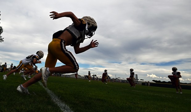 The Windsor High School football team works on kickoffs during a practice on Aug. 21, 2024 in Windsor. The team gave back and raised money for a team in North Carolina to get new practice jerseys.(Jim Rydbom/Staff Photographer)