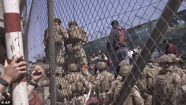 This image from a video released by the Department of Defense shows U.S. Marines at Abbey Gate before a suicide bomber struck outside Hamid Karzai International Airport