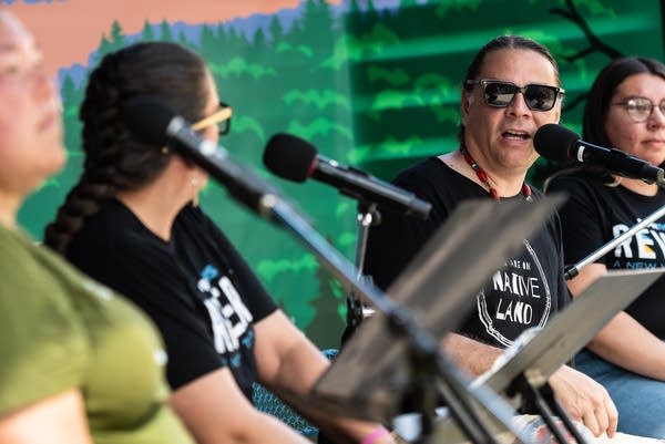 A man talks into a microphone