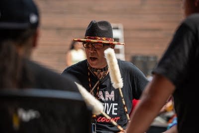 A man plays the drums