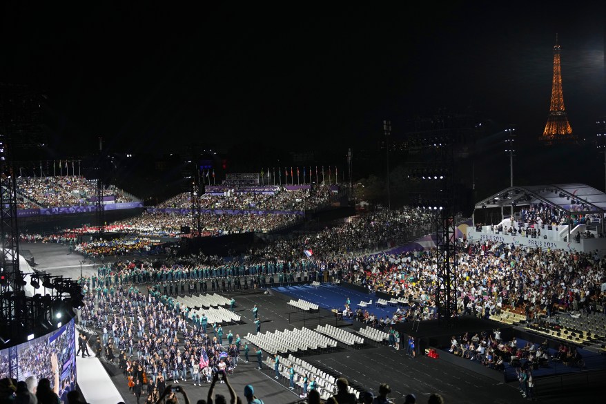 The United States, foreground left, and France, center right, athletes parade during the Opening Ceremony for the 2024 Paralympics.