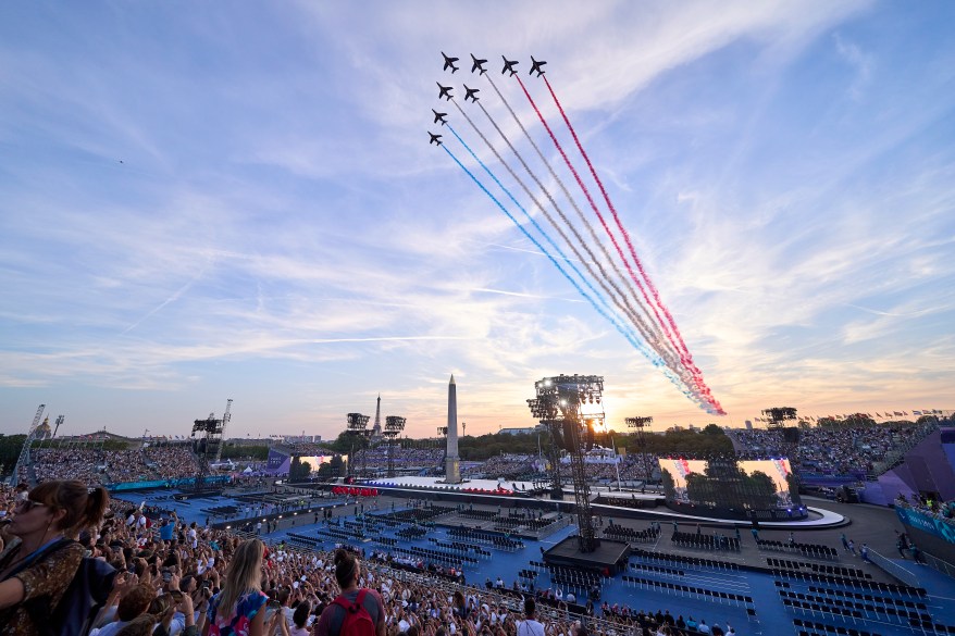 The Patrouille acrobatique de France perform a flyby whilst releasing smoke in the colours of the French flag during the opening ceremony of the Paris 2024 Summer Paralympic Games at Stade de France on August 28, 2024 in Paris, France.